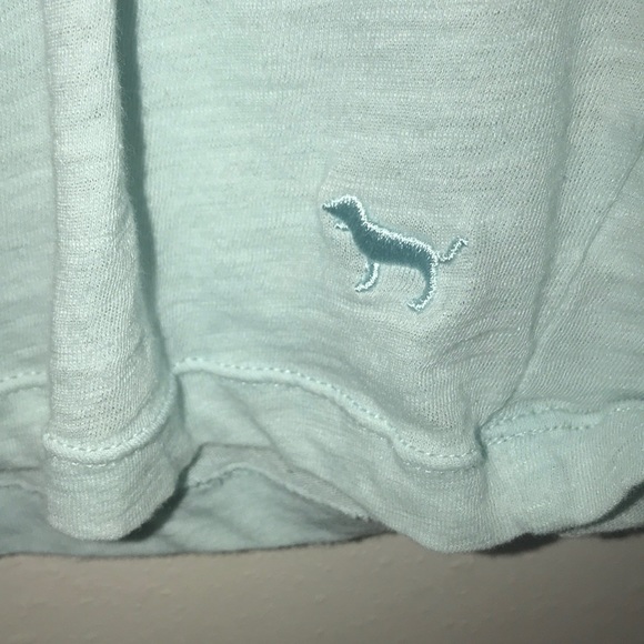 A blue tee with a black and white striped pocket - Picture 2 of 4